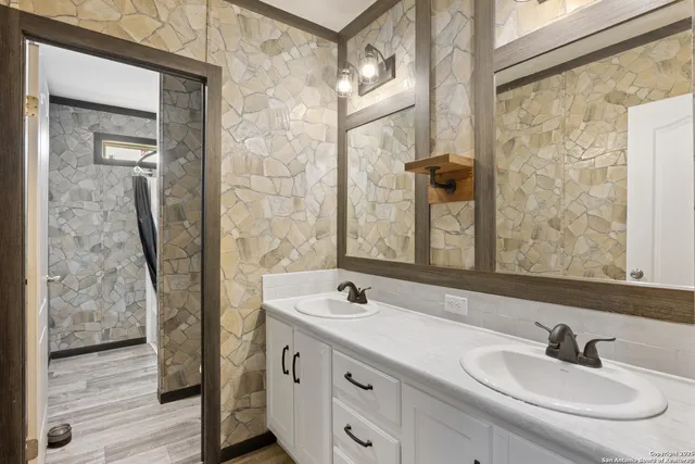 a bathroom with a sink and a mirror