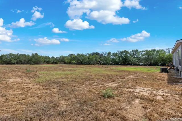 a view of lake with green space
