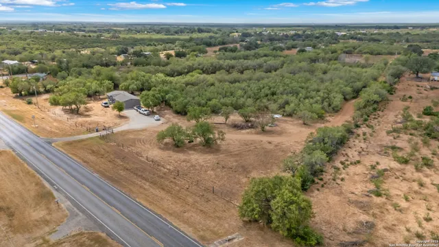 an aerial view of residential houses with outdoor space