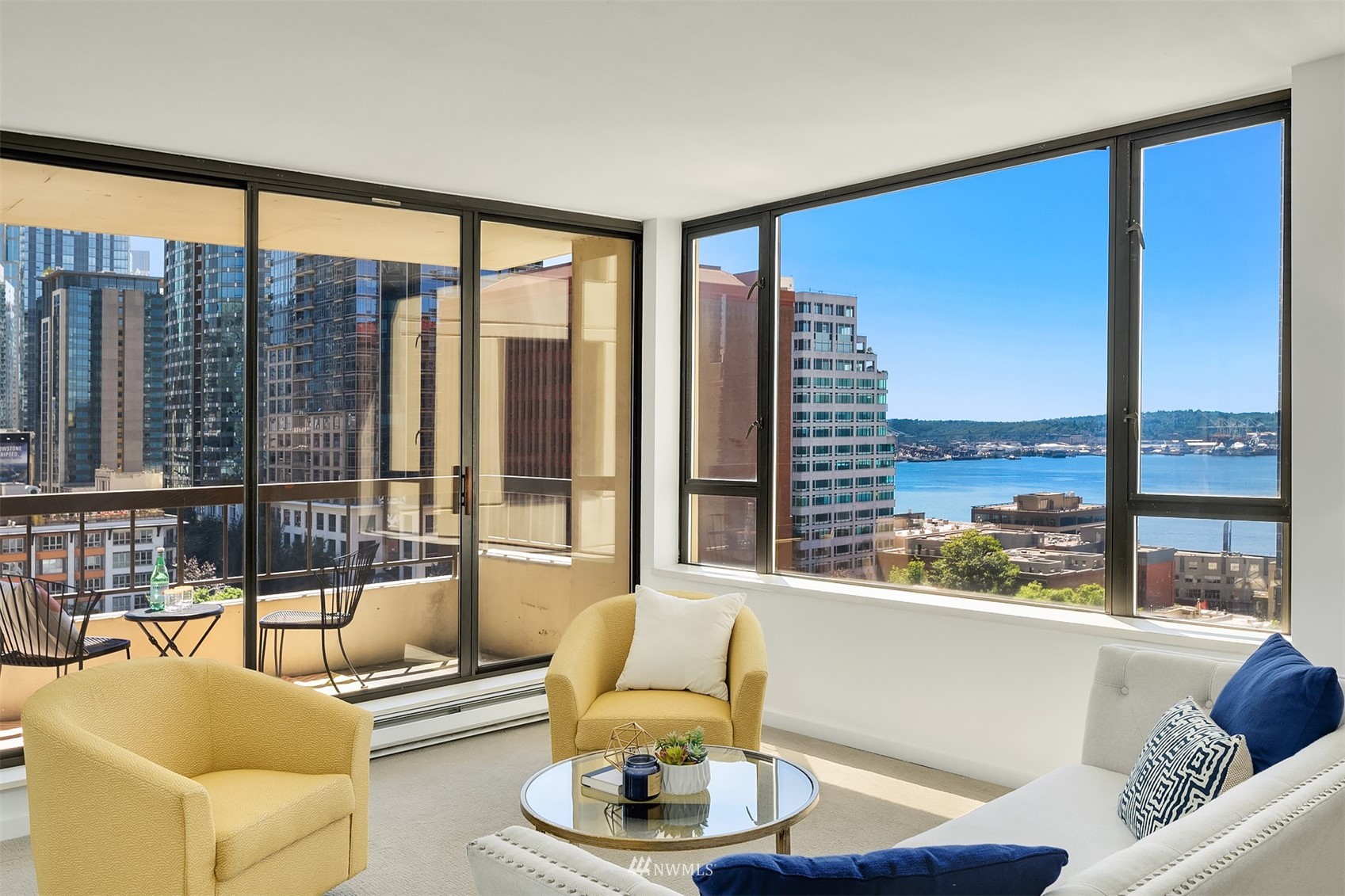 2201 3rd Avenue, Unit 1501 Seattle, WA 98121 - Photo 1 of 34 a living room with furniture and a large window