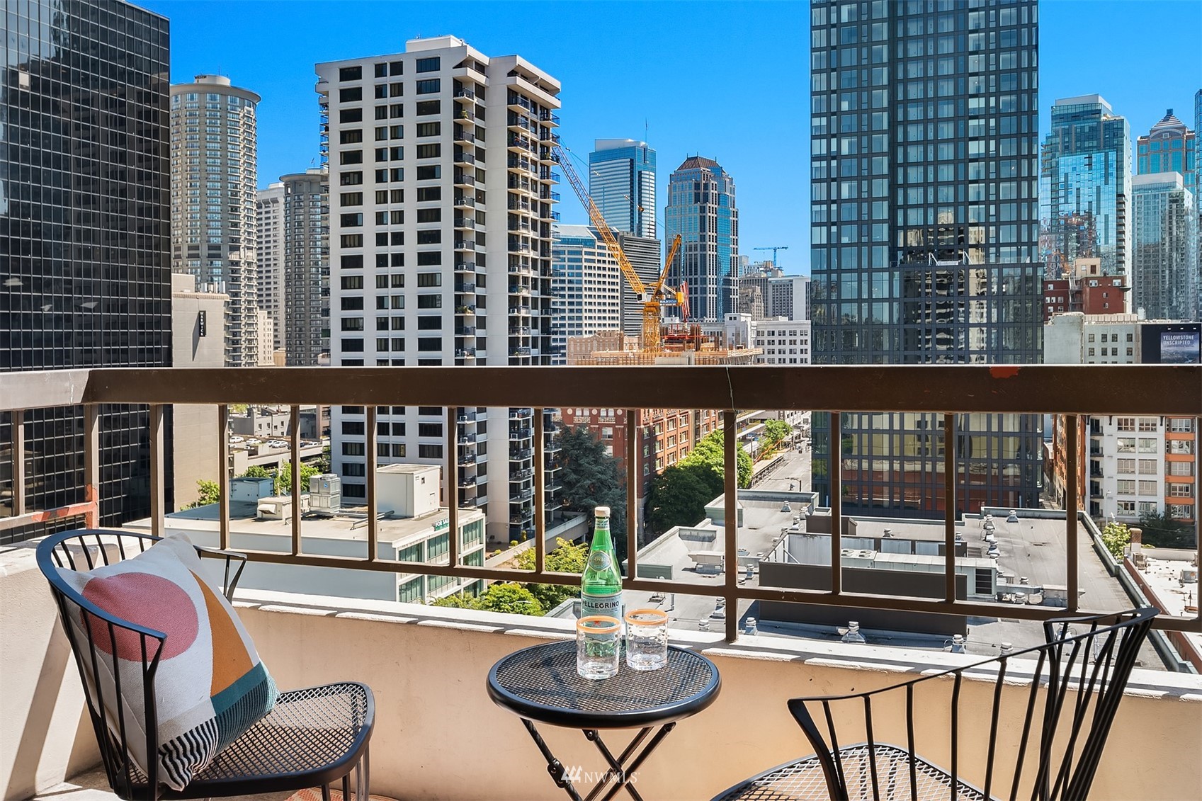 2201 3rd Avenue, Unit 1501 Seattle, WA 98121 - Photo 12 of 34 a balcony with table and chairs