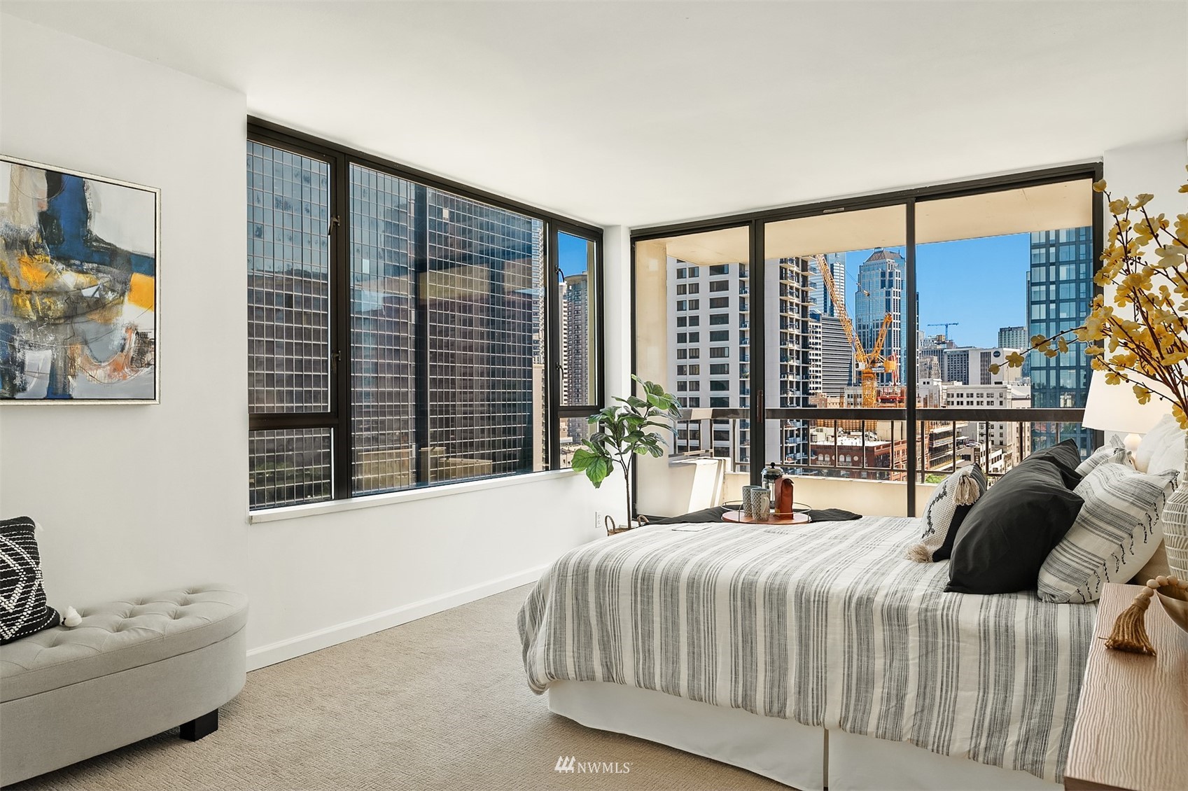 2201 3rd Avenue, Unit 1501 Seattle, WA 98121 - Photo 16 of 34 a bedroom with a large bed and a large window