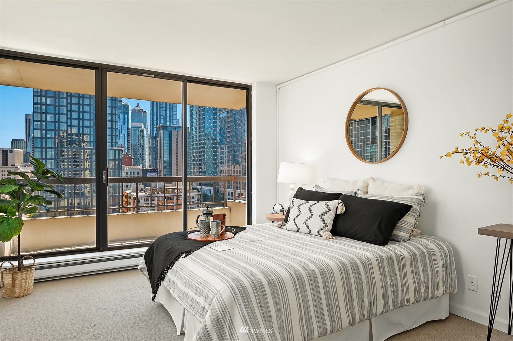 2201 3rd Avenue, Unit 1501 Seattle, WA 98121 - Photo 17 of 34 a bedroom with a large bed and a large window