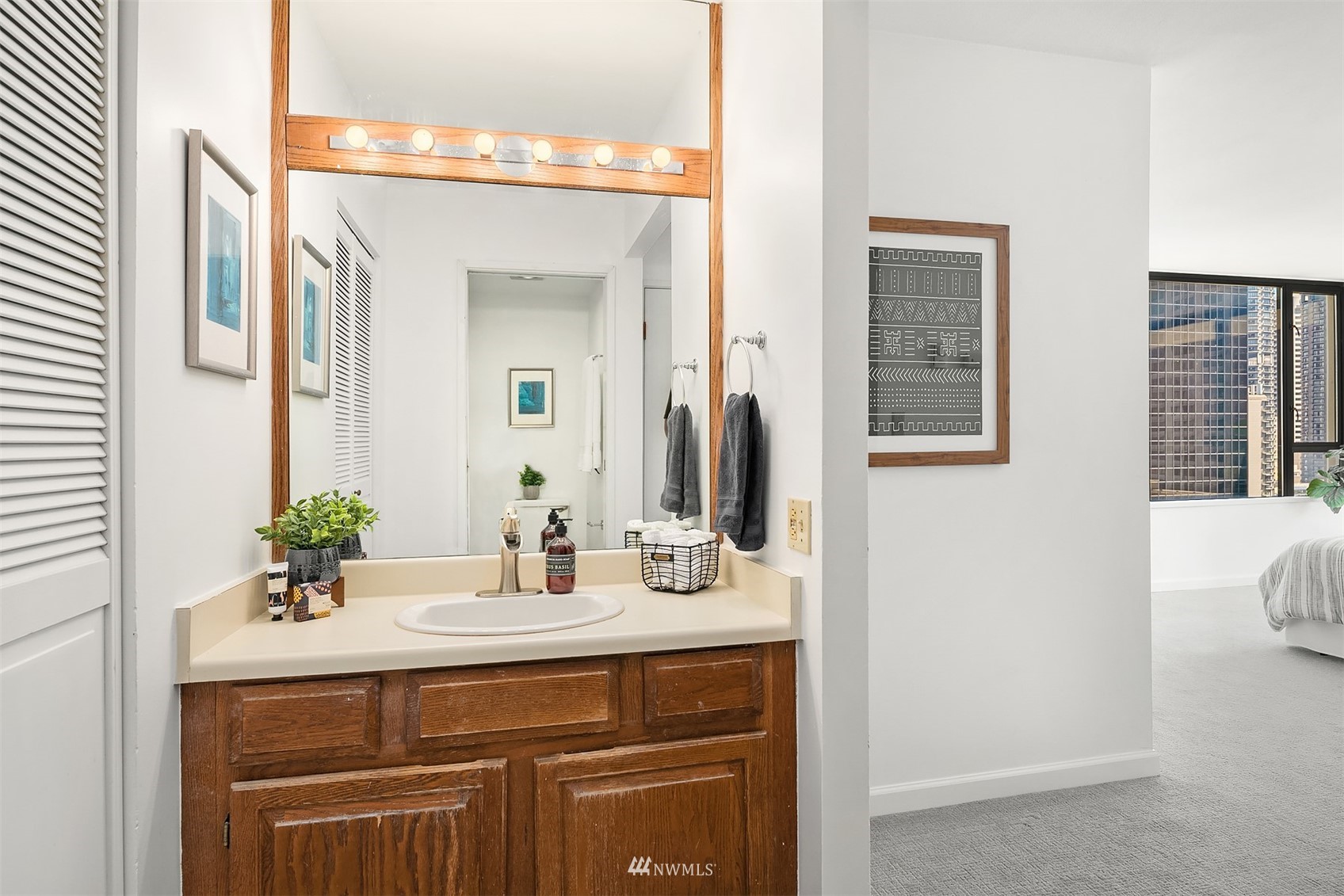 2201 3rd Avenue, Unit 1501 Seattle, WA 98121 - Photo 21 of 34 a bathroom with a sink and a mirror