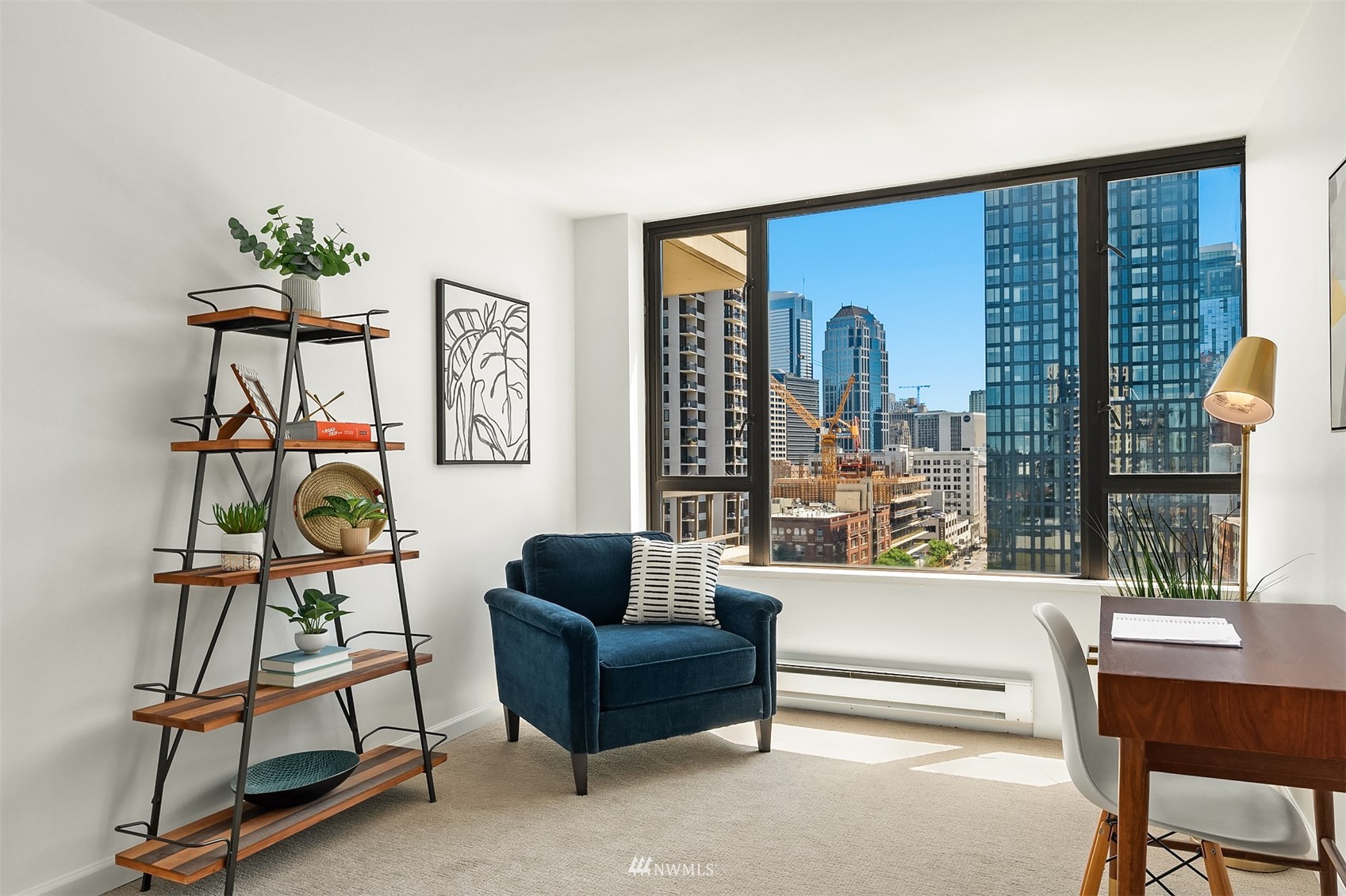 2201 3rd Avenue, Unit 1501 Seattle, WA 98121 - Photo 23 of 34 a living room with furniture a floor to ceiling window and a potted plant