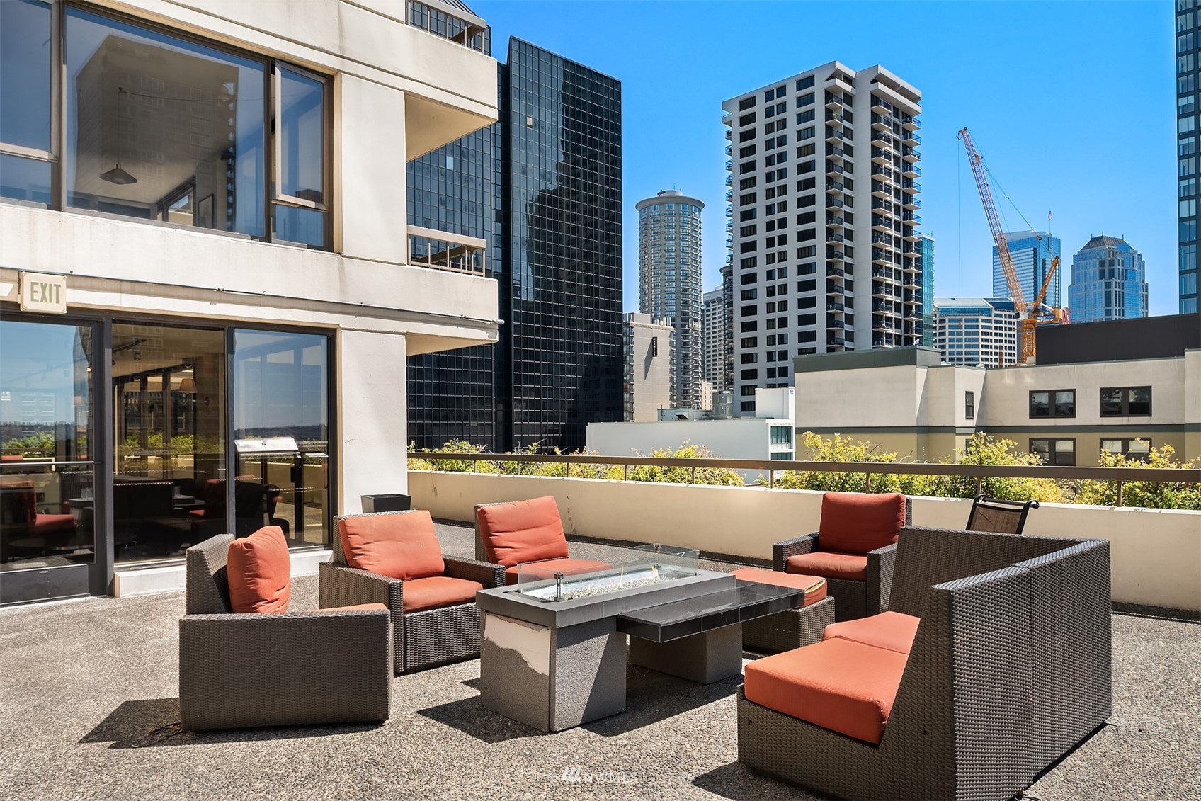2201 3rd Avenue, Unit 1501 Seattle, WA 98121 - Photo 25 of 34 a view of a patio with couches and a potted plant on a table