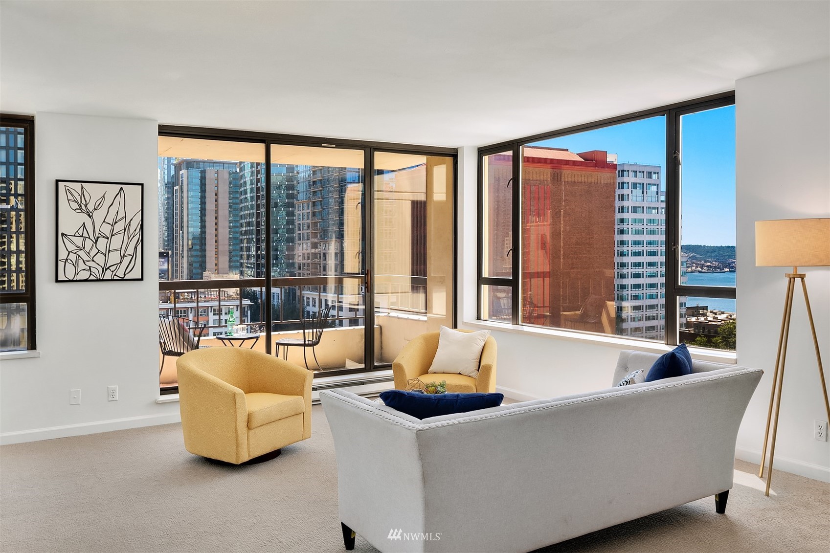 2201 3rd Avenue, Unit 1501 Seattle, WA 98121 - Photo 3 of 34 a living room with furniture and a large window