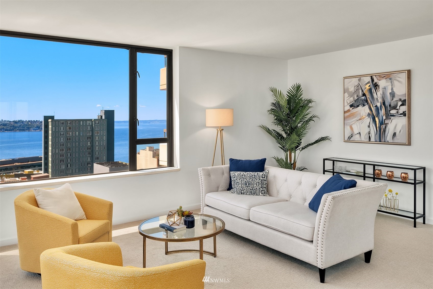 2201 3rd Avenue, Unit 1501 Seattle, WA 98121 - Photo 6 of 34 a living room with furniture and a potted plant