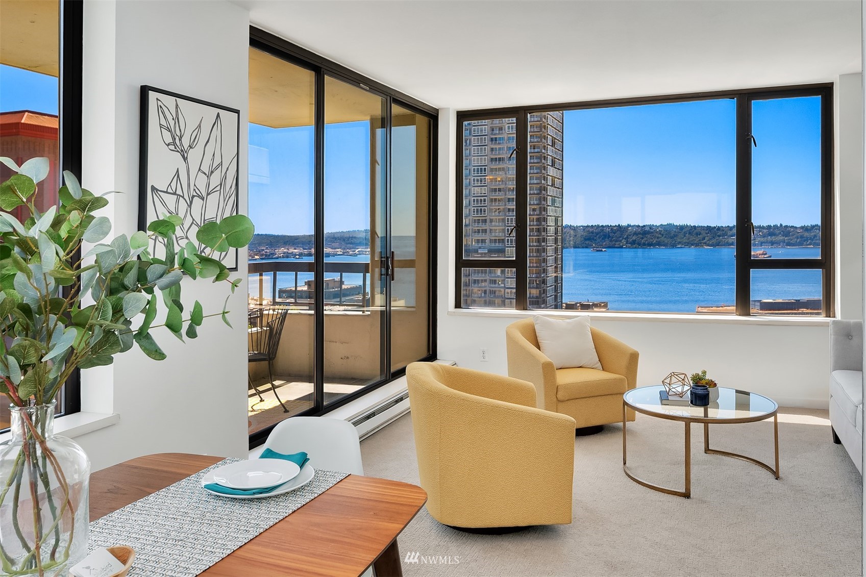 2201 3rd Avenue, Unit 1501 Seattle, WA 98121 - Photo 10 of 34 a living room with furniture and a large window