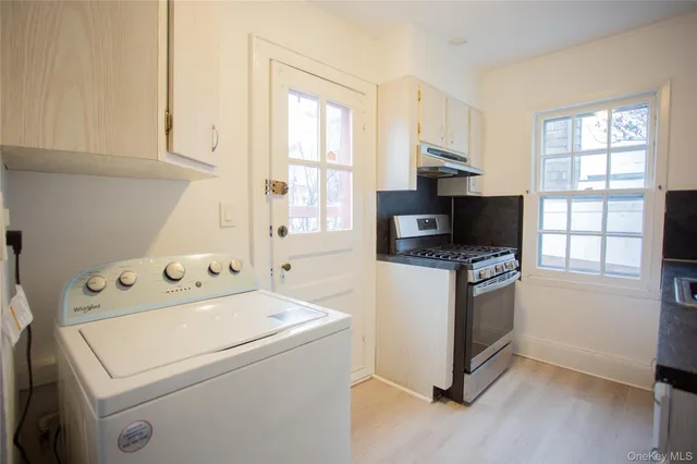 a kitchen with a stove and a microwave