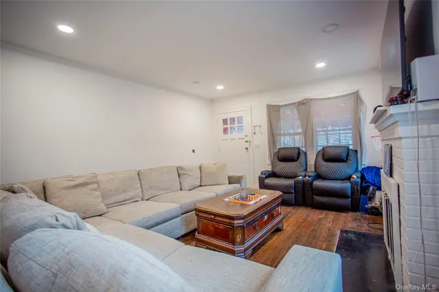a living room with furniture a couch and a fireplace