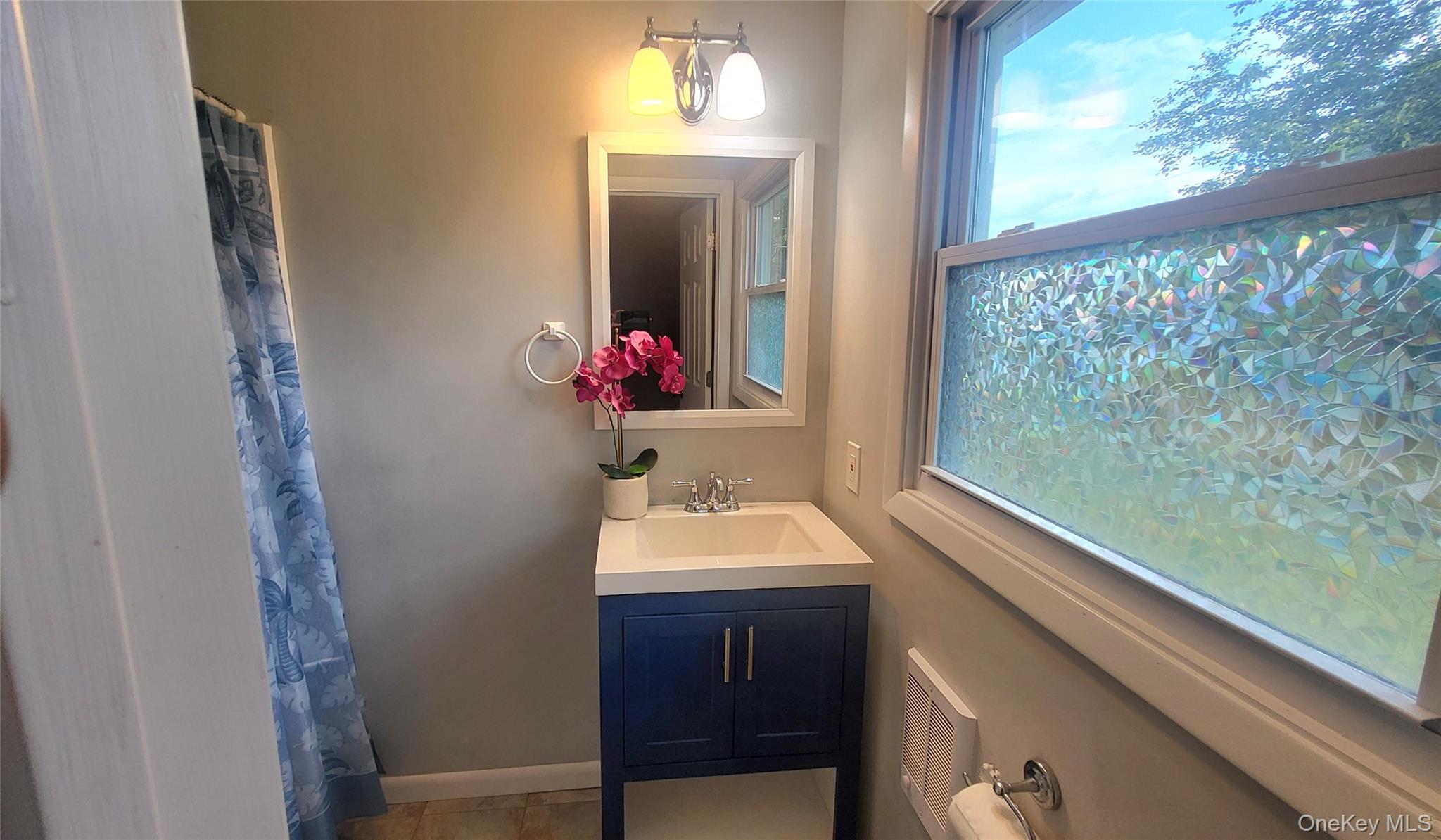 12 High Ridge Road Poughkeepsie, NY 12603 - Photo 25 of 34 Primary bathroom's vanity with mirror