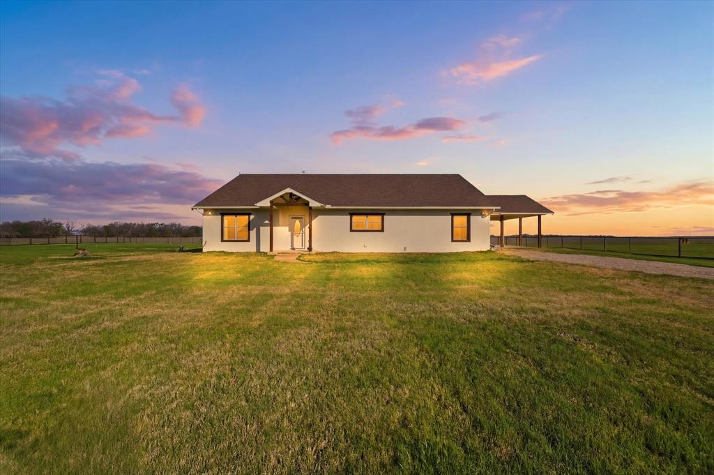 1616 Nash-Howard Road Waxahachie, TX 75165 - Photo 4 of 36 a front view of a house with a garden