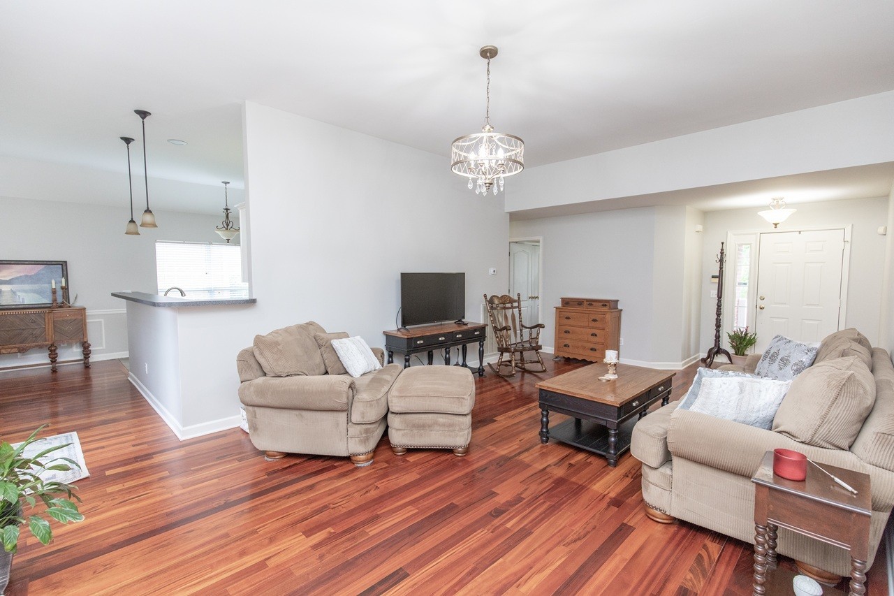 5012 John Hagar Road Hermitage, TN 37076 - Photo 11 of 45 a living room with furniture kitchen view and a wooden floor