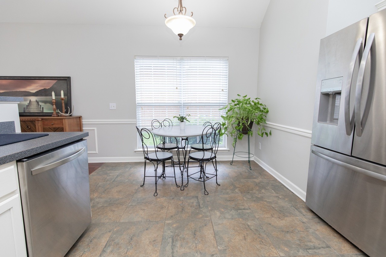 5012 John Hagar Road Hermitage, TN 37076 - Photo 14 of 45 a view of a dining room with furniture and a chandelier