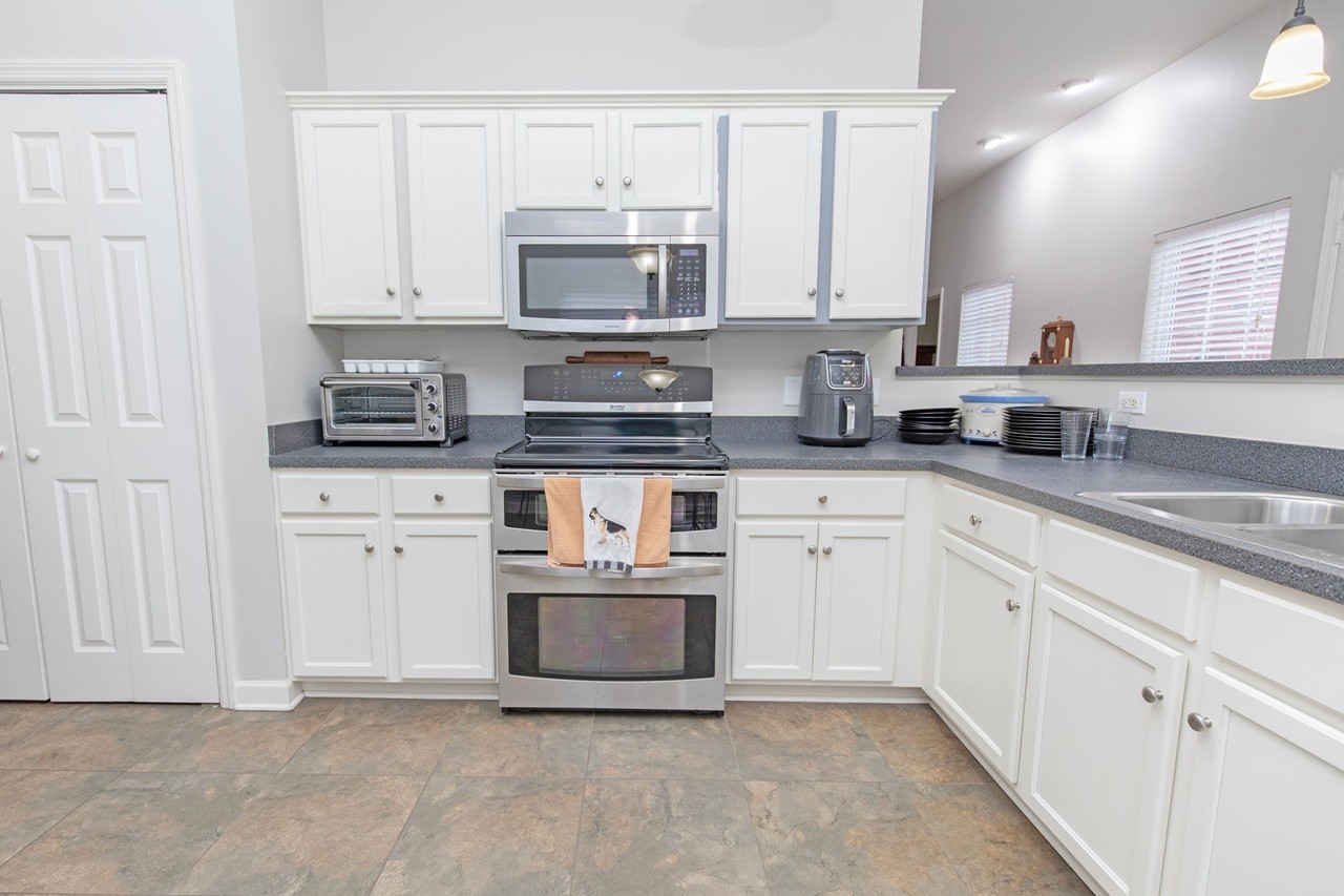 5012 John Hagar Road Hermitage, TN 37076 - Photo 15 of 45 a kitchen with white cabinets appliances and sink