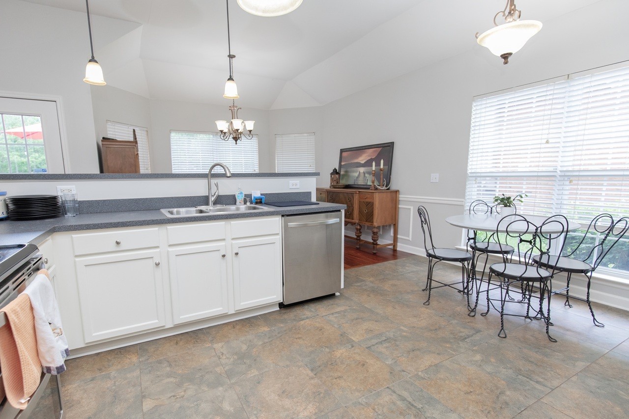 5012 John Hagar Road Hermitage, TN 37076 - Photo 16 of 45 a kitchen with a table chairs and white cabinets