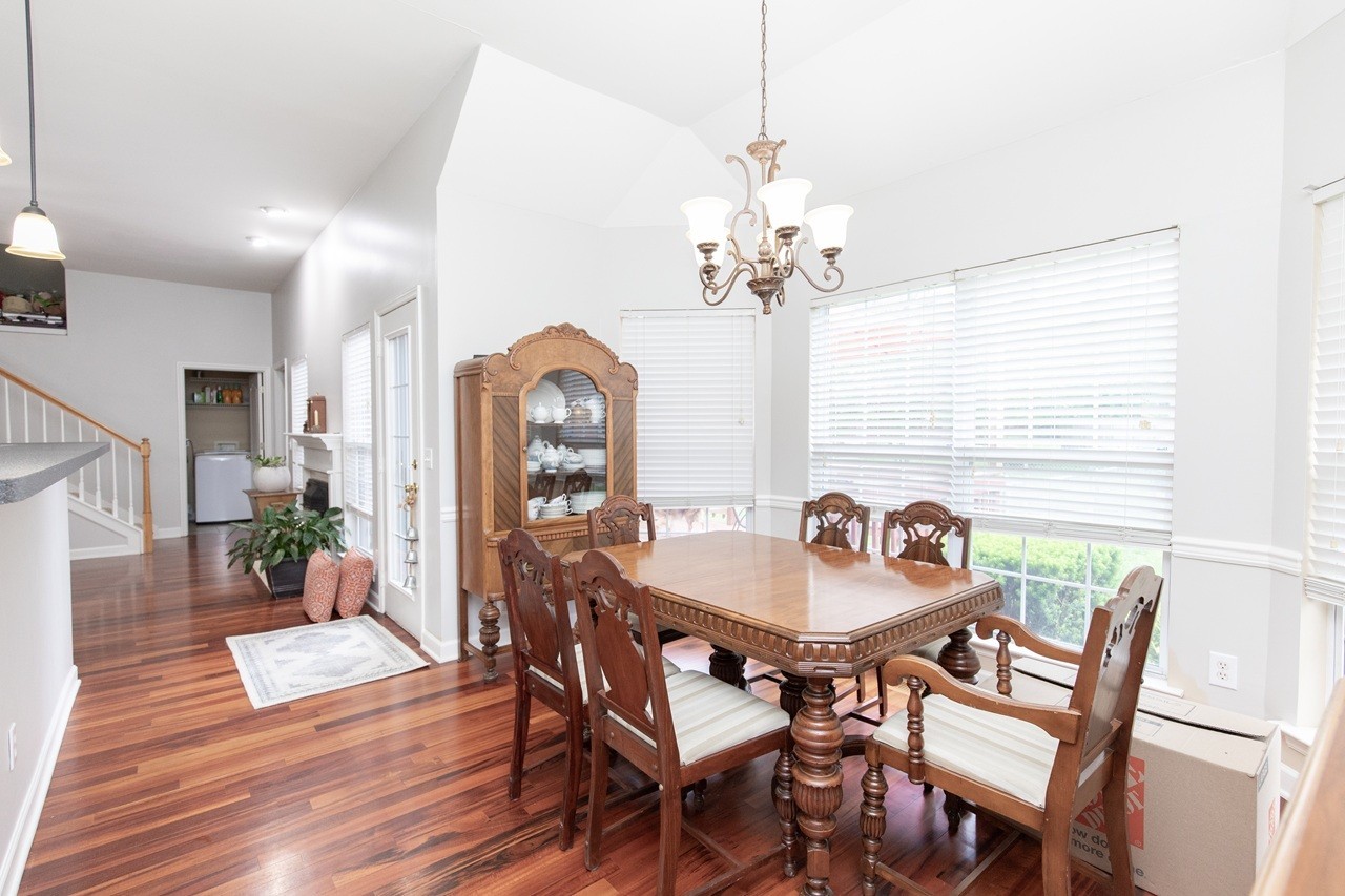5012 John Hagar Road Hermitage, TN 37076 - Photo 19 of 45 a dining room with furniture a chandelier and wooden floor