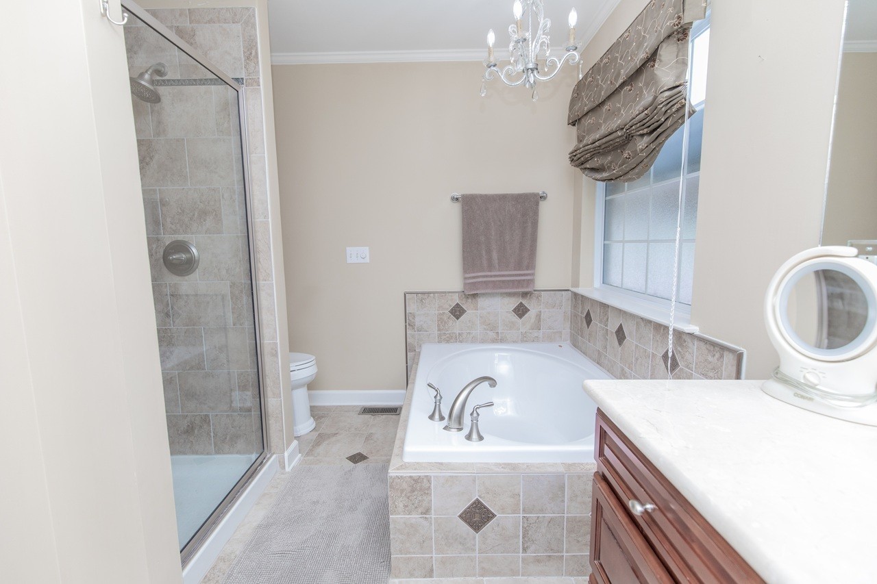 5012 John Hagar Road Hermitage, TN 37076 - Photo 23 of 45 a bathroom with a sink a toilet and shower