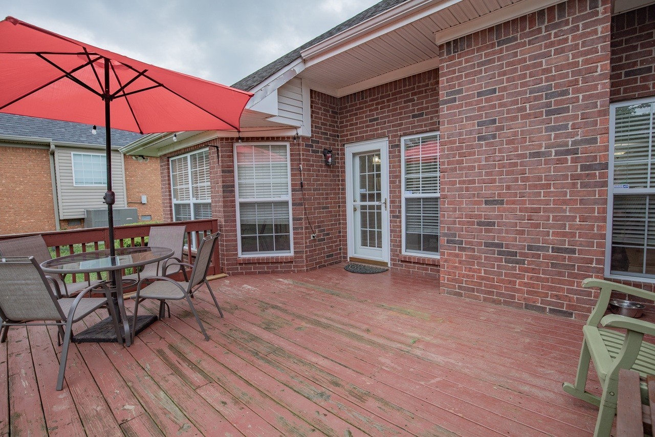 5012 John Hagar Road Hermitage, TN 37076 - Photo 33 of 45 a view of a patio with table and chairs under an umbrella