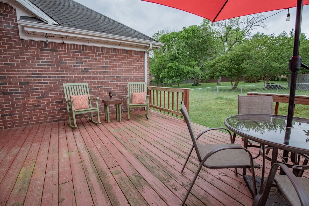 5012 John Hagar Road Hermitage, TN 37076 - Photo 36 of 45 a view of a patio with table and chairs with wooden floor and fence