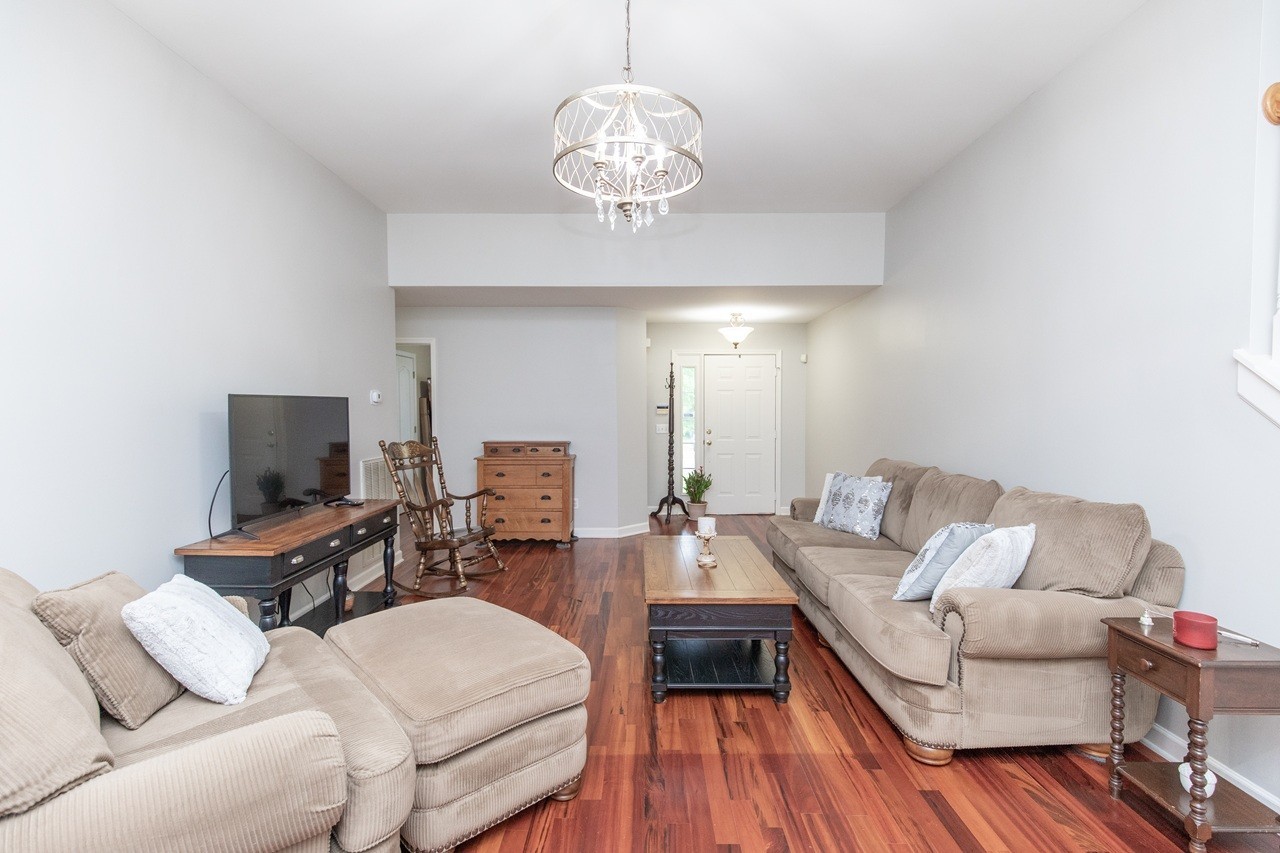 5012 John Hagar Road Hermitage, TN 37076 - Photo 7 of 45 a living room with furniture a flat screen tv and a large window