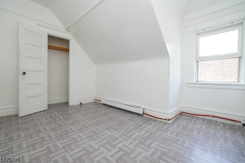 26 Treacy Avenue, Unit 1 Newark, NJ 07108 - Photo 12 of 18 an empty room with windows