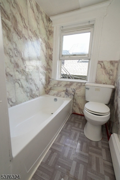 26 Treacy Avenue, Unit 1 Newark, NJ 07108 - Photo 17 of 18 a bathroom with a toilet and a bathtub