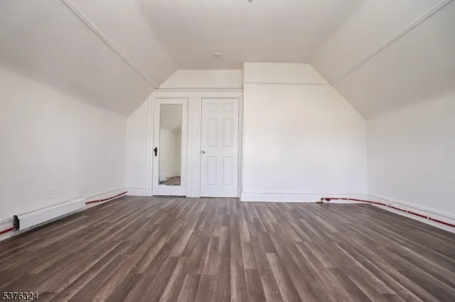 a view of room with wooden floor