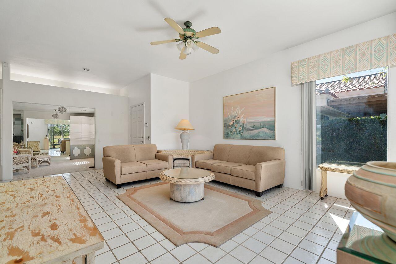 36 Colonial Drive Rancho Mirage, CA 92270 - Photo 13 of 36 a living room with furniture and a large window