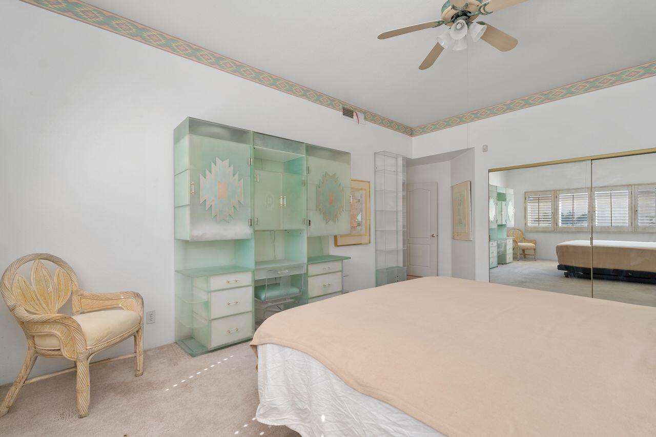 36 Colonial Drive Rancho Mirage, CA 92270 - Photo 18 of 36 a bedroom with a bed and window