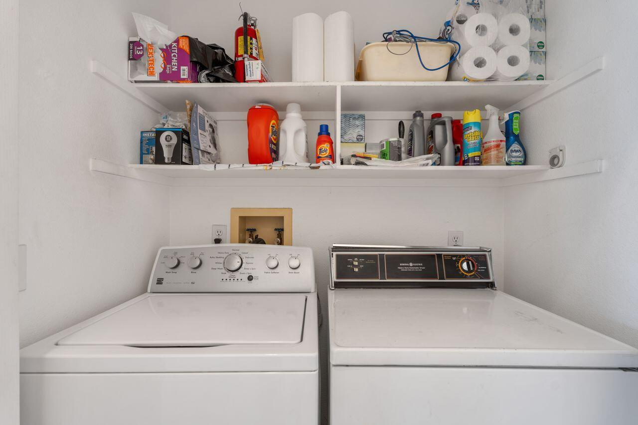 36 Colonial Drive Rancho Mirage, CA 92270 - Photo 24 of 36 a utility room with lots of clutter and cabinets