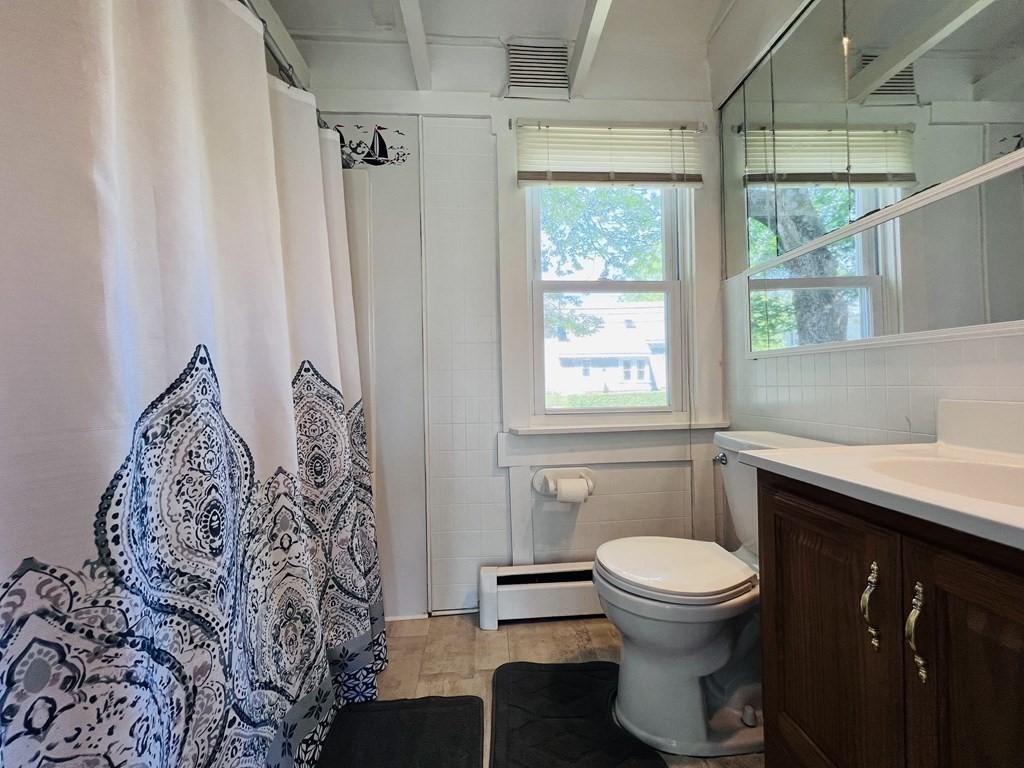 72 Oak Street Middleboro, MA 02346 - Photo 14 of 42 a bathroom with a toilet sink and window