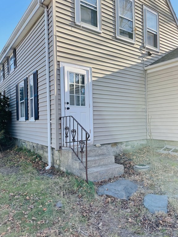 72 Oak Street Middleboro, MA 02346 - Photo 21 of 42 a view of a house with a yard and wooden fence
