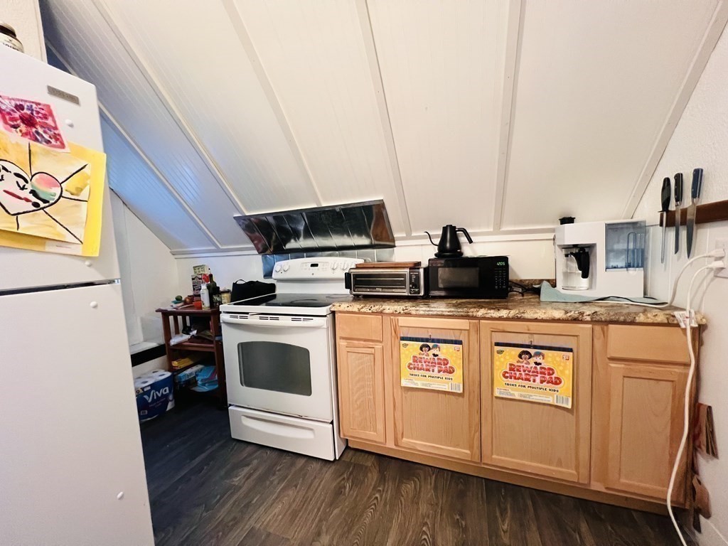 72 Oak Street Middleboro, MA 02346 - Photo 26 of 42 a kitchen with stainless steel appliances granite countertop a stove a sink and a microwave