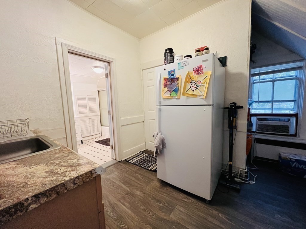 72 Oak Street Middleboro, MA 02346 - Photo 27 of 42 a kitchen with a refrigerator and a stove top oven