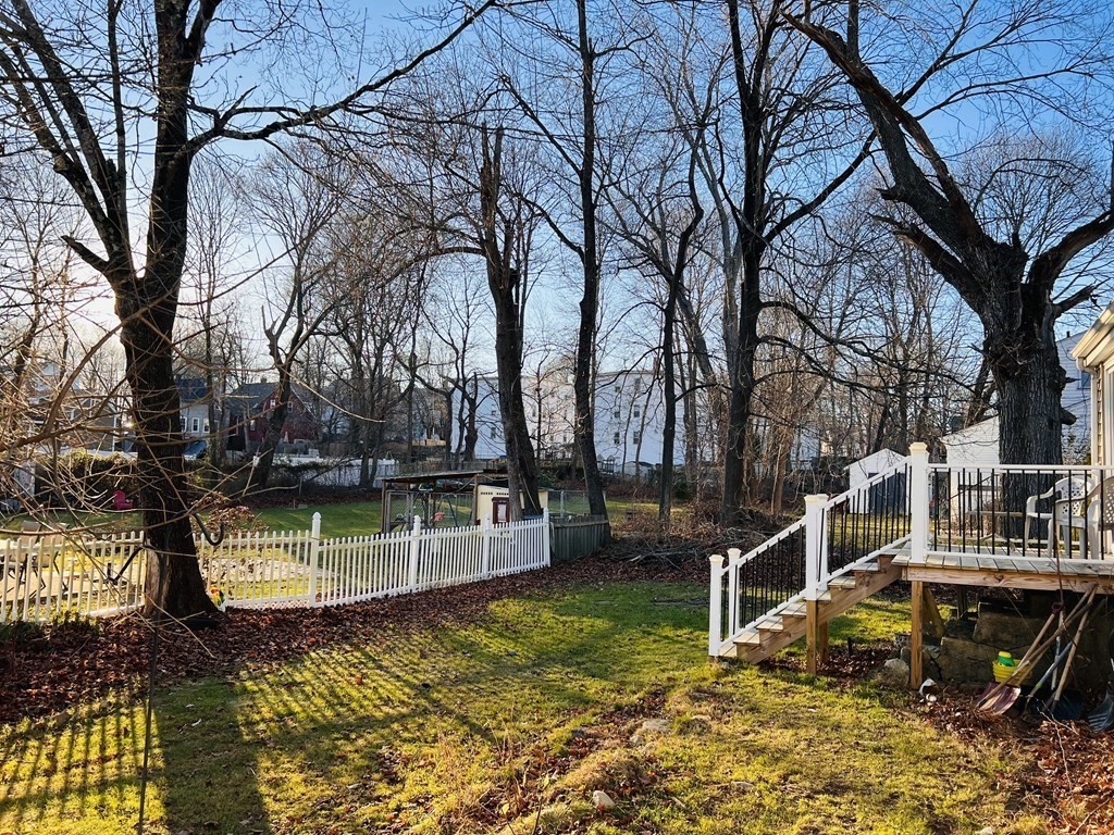 72 Oak Street Middleboro, MA 02346 - Photo 3 of 42 a view of a yard with wooden fence