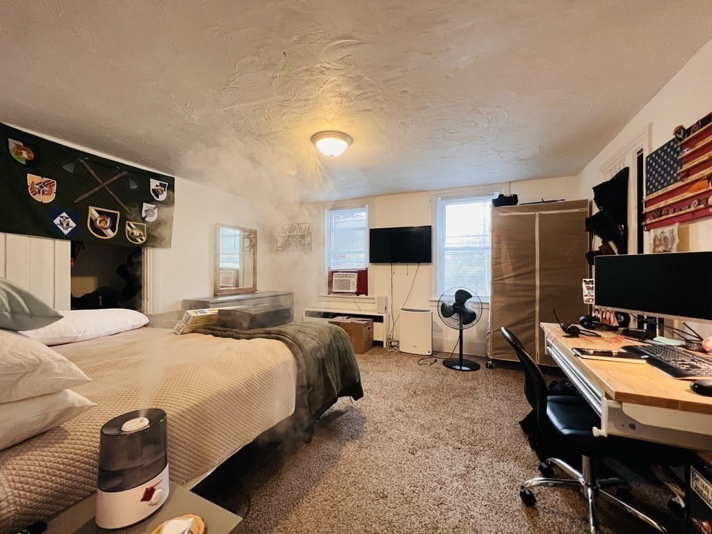 72 Oak Street Middleboro, MA 02346 - Photo 32 of 42 a bedroom with furniture and a flat screen tv