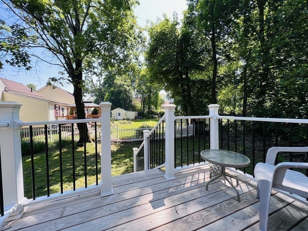72 Oak Street Middleboro, MA 02346 - Photo 8 of 42 a view of a deck with furniture and garden