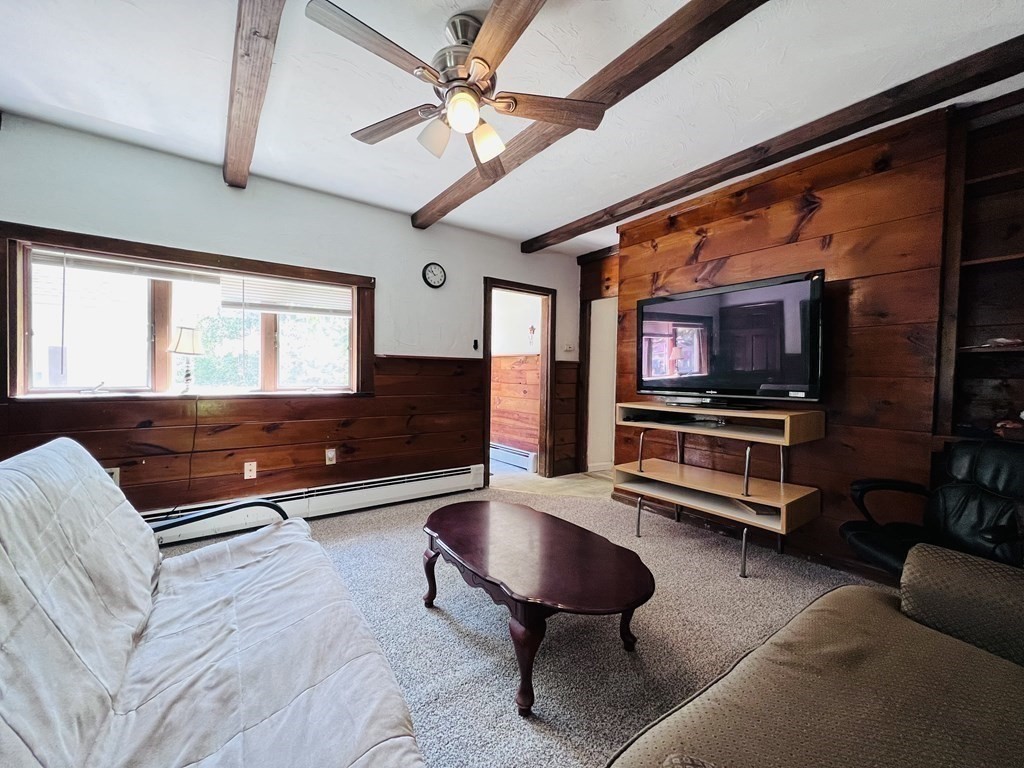 72 Oak Street Middleboro, MA 02346 - Photo 10 of 42 a living room with furniture and a flat screen tv