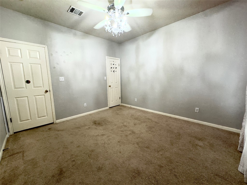 401 Witte Road Kyle, TX 78640 - Photo 17 of 33 an empty room with chandelier fan