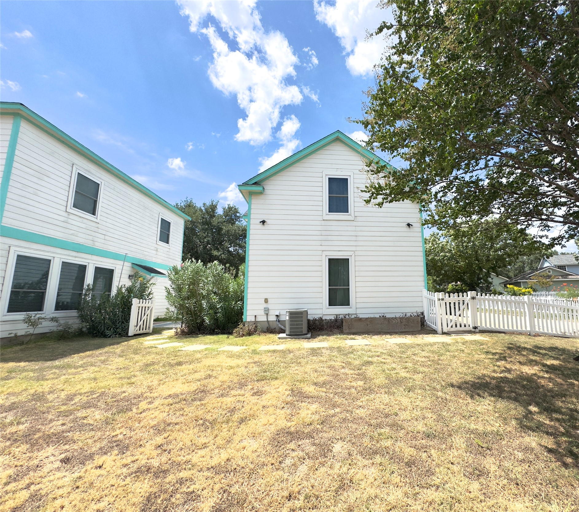 401 Witte Road Kyle, TX 78640 - Photo 18 of 33 a view of a house with a yard