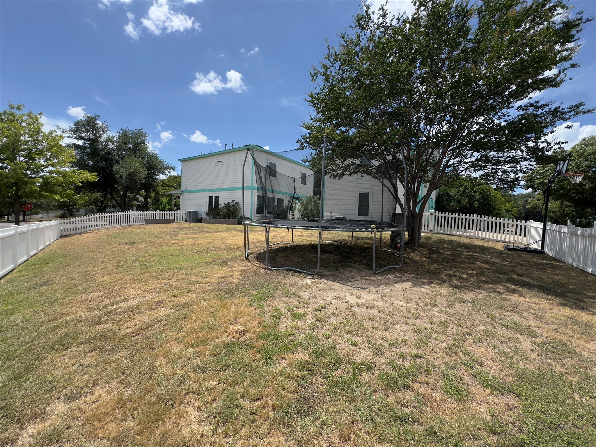 401 Witte Road Kyle, TX 78640 - Photo 19 of 33 a view of a house with a yard