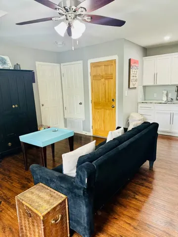 a living room with furniture and a table