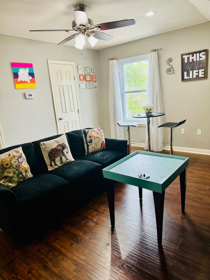 401 Witte Road Kyle, TX 78640 - Photo 25 of 33 a living room with furniture and a wooden floor