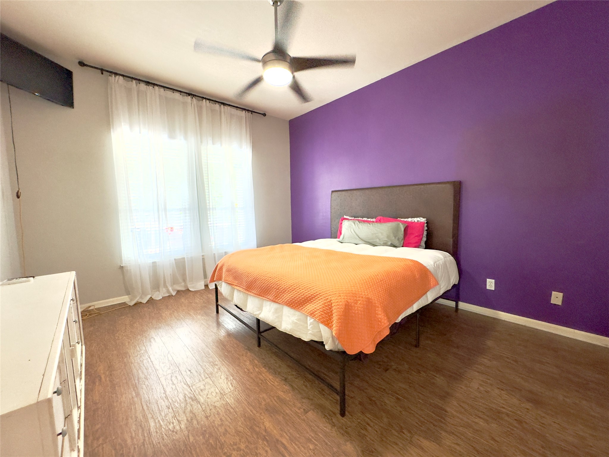 401 Witte Road Kyle, TX 78640 - Photo 3 of 33 a bedroom with a bed and a chandelier