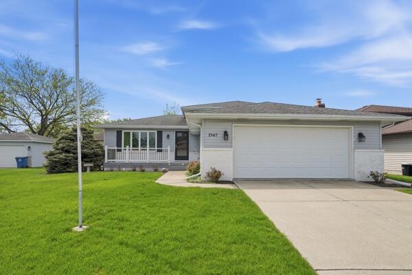 1547 West 99th Avenue Crown Point, IN 46307 - Photo 1 of 21 a view of a house with a yard and sitting area