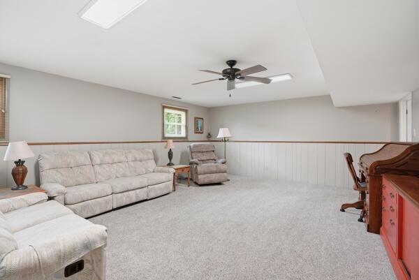 1547 West 99th Avenue Crown Point, IN 46307 - Photo 13 of 21 a living room with furniture and a chandelier