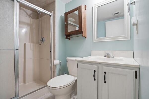 1547 West 99th Avenue Crown Point, IN 46307 - Photo 15 of 21 a bathroom with a toilet a sink and mirror