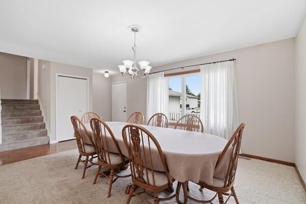 1547 West 99th Avenue Crown Point, IN 46307 - Photo 3 of 21 a view of a dining room with furniture and chandelier